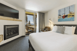 firelite-room-1-min king room with fireplace at firelite lodge